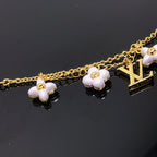 LOUIS VUITTON LOGO 6 MOTIF STAR AND SUN GOLD BRACELET