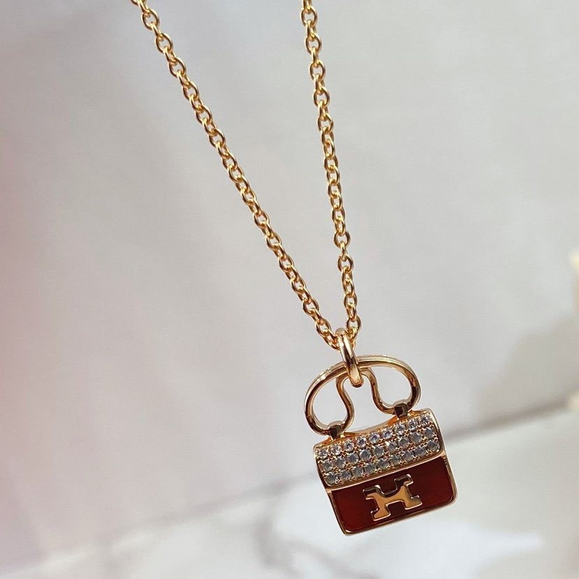 HERMES CONSTANCE RED PEDANT PINK GOLD NECKLACE