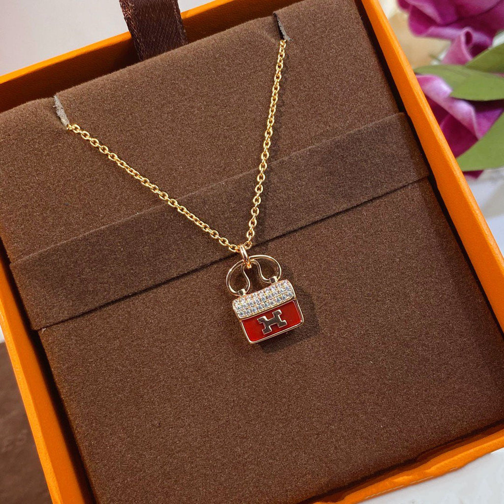 HERMES CONSTANCE RED PEDANT PINK GOLD NECKLACE