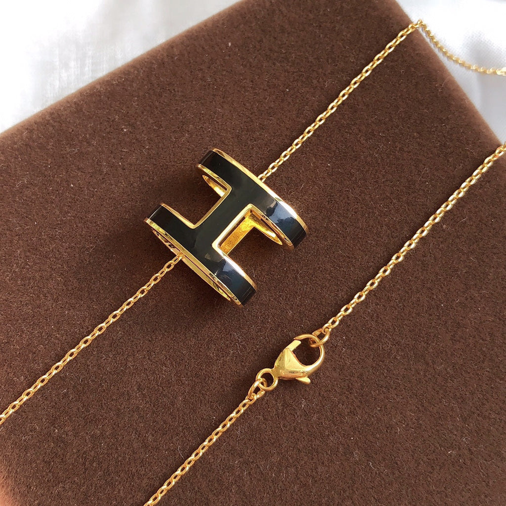 HERMES HM CLIC BLACK ENAMEL GOLD NECKLACE